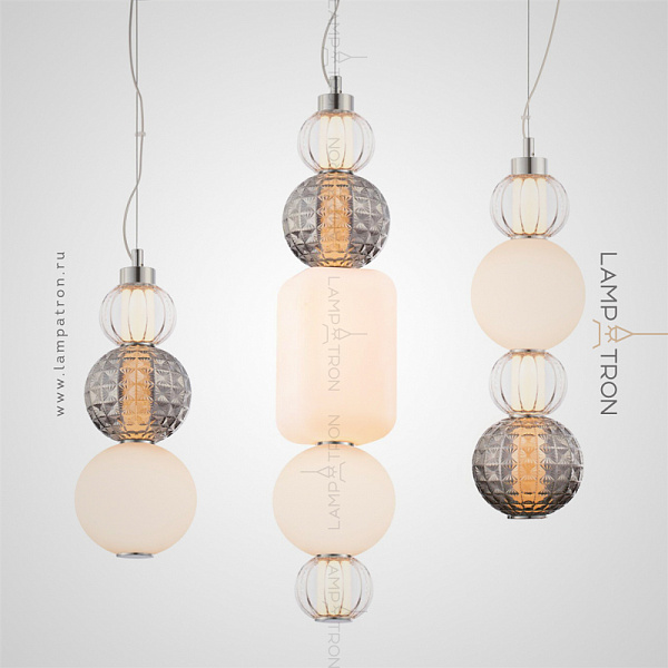 Серия подвесных светильников из вертикально расположенных стеклянных элементов разной формы, цвета и фактуры ATTIRE